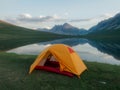 AI Generated Camping Tent Beside Mountain Lake in Scenic Landscape Royalty Free Stock Photo