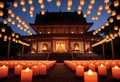 candles are lit in front of a temple at night Royalty Free Stock Photo