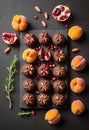 chocolate covered fruit on a black slate Royalty Free Stock Photo