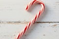 AI generated. Christmas candy cane, on a white wooden background. Christmas background Royalty Free Stock Photo