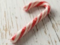 AI generated. Christmas candy cane, on a white wooden background. Christmas background Royalty Free Stock Photo