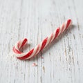 AI generated. Christmas candy cane, on a white wooden background. Christmas background Royalty Free Stock Photo