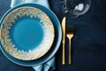 AI generated. Christmas table setting with empty blue ceramic plate, glass and festive decorations