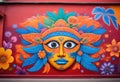 a colorful mural of a mask on a wall