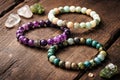 Natural Gemstone Bracelet Set Displayed On Rustic Wooden Surface Royalty Free Stock Photo