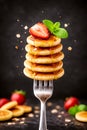 Mini Pancake Stack With Honey Strawberry And Mint On Fork Royalty Free Stock Photo