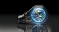 The illuminated world globe inside a classic lightbulb on a dark surface, symbolizing global eco energy and innovation. Royalty Free Stock Photo