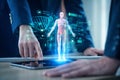 AI generated digital healthcare visualization showing collaborative medical team using holographic human body data analysis with Royalty Free Stock Photo