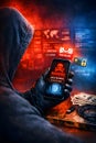 Hacker Holding Smartphone With Cyber Attack Warning Screen And Digital Threat Atmosphere Royalty Free Stock Photo