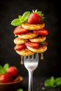 Vertical Stack Of Mini Pancakes With Fresh Strawberries Mint And Honey Drizzle Royalty Free Stock Photo