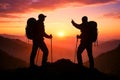Silhouette Of Two Hikers With Backpacks Watching Mountain Sunset Royalty Free Stock Photo