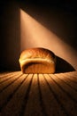 Dramatic Light Falling On Fresh Bread Loaf Creating Minimal Still Life Royalty Free Stock Photo