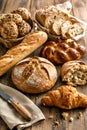 Assorted Artisan Breads Displayed On Rustic Wooden Table Setting Royalty Free Stock Photo