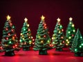 Full frame of small green Christmas trees with colored Christmas lights and tips with a bright star, nuanced red background