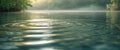 Gentle ripples reflect light on clear water surface in a tranquil natural setting during daylight hours. Royalty Free Stock Photo