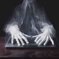 AI generated ghost figure on computer keyboard Royalty Free Stock Photo