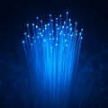 AI generated glowing blue fiber optic strands forming a vertical light structure with bright tips and deep contrast creating a Royalty Free Stock Photo
