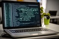AI generated hacker laptop with binary computer code internet and network security Royalty Free Stock Photo