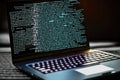 AI generated hacker laptop with binary computer code internet and network security Royalty Free Stock Photo