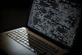 AI generated hacker laptop with binary computer code internet and network security Royalty Free Stock Photo