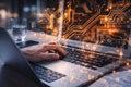 AI generated hands using laptop with holographic circuit board overlay and desk devices representing information technology data Royalty Free Stock Photo