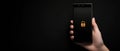 Minimalistic smartphone displaying a glowing yellow padlock icon on a black background, symbolizing secure digital access, priv