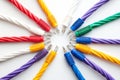 Colorful Ethernet cables arranged in a circular pattern on a white background representing data transmission secure communicati