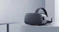 Sleek Dark Virtual Reality (VR) Headset Displayed on Minimalist Pedestal in Studio Royalty Free Stock Photo