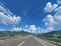 Chinese Highway Wide Angle View with Mountains and Green Fields, Royalty Free Stock Photo