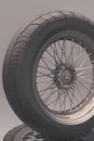AI generated illustration of an air tire and wheel rim with spokes on the gray backdrop