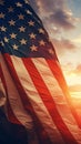 AI generated illustration of an American flag waving in the wind against a backdrop of a sunset Royalty Free Stock Photo