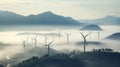 Fog-Enshrouded Giants: Windmills of the Misty Ridge Royalty Free Stock Photo