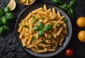 a plate of pasta with tomatoes and basil on it next to sliced lemon Royalty Free Stock Photo