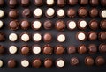 AI generated illustration of arranged rows of chocolate candies