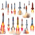 AI generated illustration of an array of launching rockets with flames on the white background Royalty Free Stock Photo