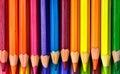 AI generated illustration of an assortment of vibrant colored pencils arranged in a gradient Royalty Free Stock Photo