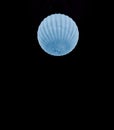 AI generated illustration of a beautiful blue moon shaped like a shell on a dark background Royalty Free Stock Photo