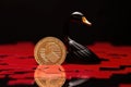 AI generated illustration of a black swan perched upon a golden coin on a red background Royalty Free Stock Photo