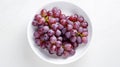 AI generated illustration of a bowl of grapes on a white background Royalty Free Stock Photo