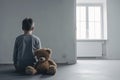 AI generated illustration of a boy with a teddy bear in an empty room - concept of autism Royalty Free Stock Photo