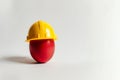 AI generated illustration of a bright hard hat on an egg Royalty Free Stock Photo