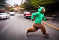 a bear in a green hoodie running across a street with traffic behind him Royalty Free Stock Photo