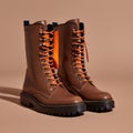 AI-generated illustration of brown boots with vibrant orange laces