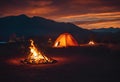 AI generated illustration of camping tents amidst mountains, illuminated by fires at night Royalty Free Stock Photo