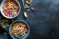 two bowls filled with colorful cereal sitting on top of a black counter Royalty Free Stock Photo