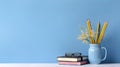AI generated illustration of decorative plants in a pot near a stack of books against a  blue wall Royalty Free Stock Photo