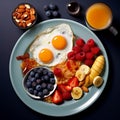 breakfast plate on black table with orange juice and blueberries