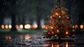 a small christmas tree in the rain with red ornaments hanging on it Royalty Free Stock Photo