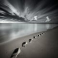 AI generated illustration of Footprints left in the sand by the ocean's waves on a clouded day Royalty Free Stock Photo