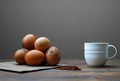 AI generated illustration of fresh eggs stacked beside a cup of coffee Royalty Free Stock Photo